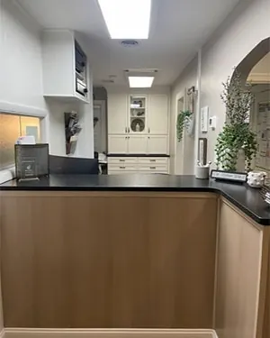 The front desk counter and corridor at Sicher Family Dentistry.